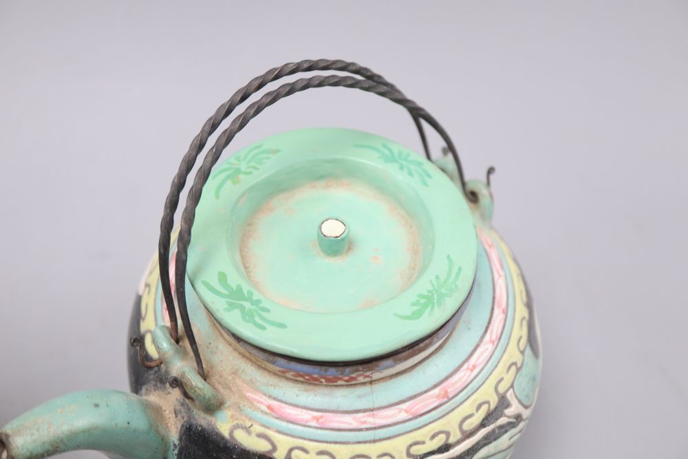 A Chinese enamelled Yixing teapot, height 13cm and a black Yixing teapot